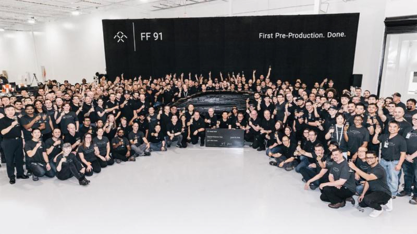 Travis Cournoyer and the rest of the staff when the first Pre-Production FF91 rolled off the line.