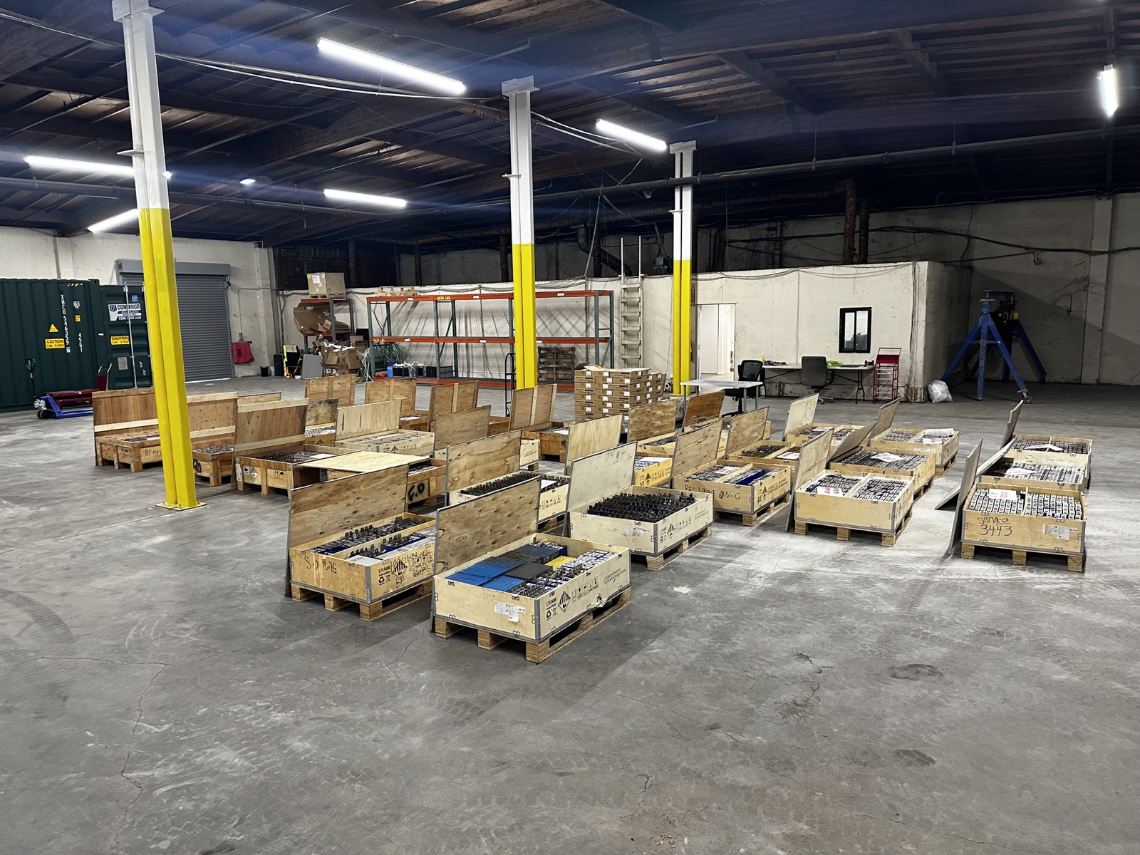 Battery modules and prototype materials staged for development work.